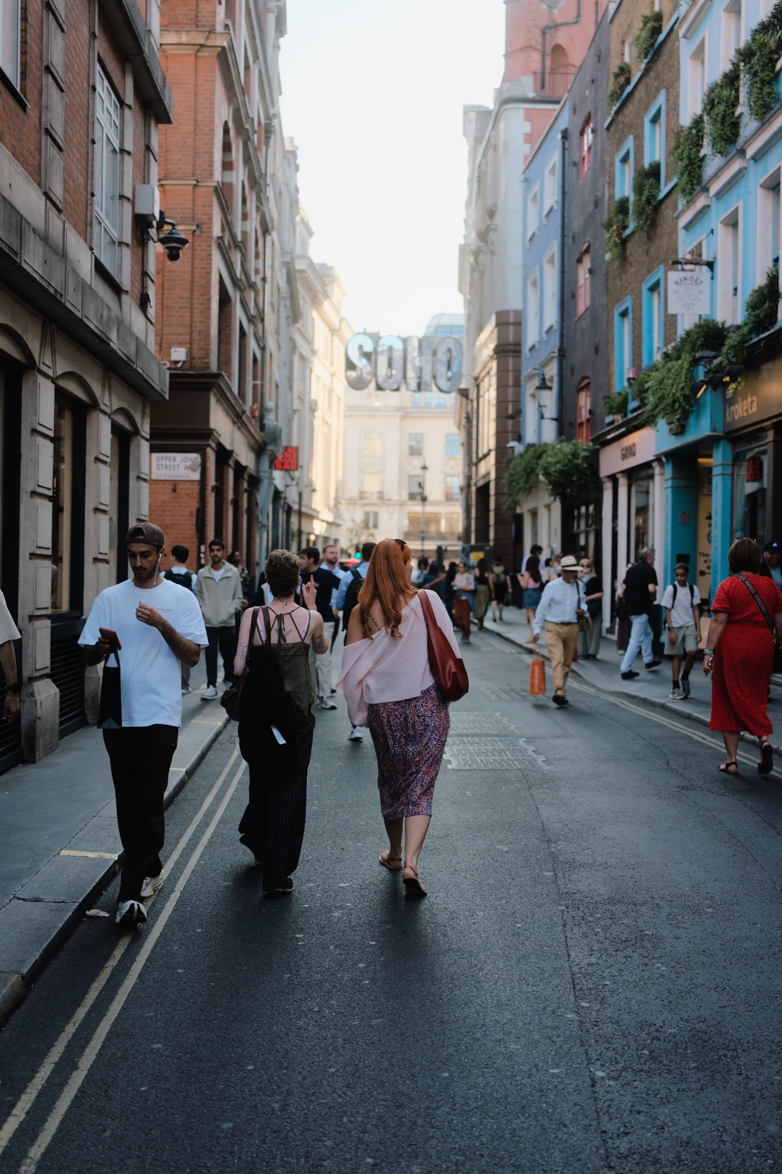 Pedestrians in a wider street scene
