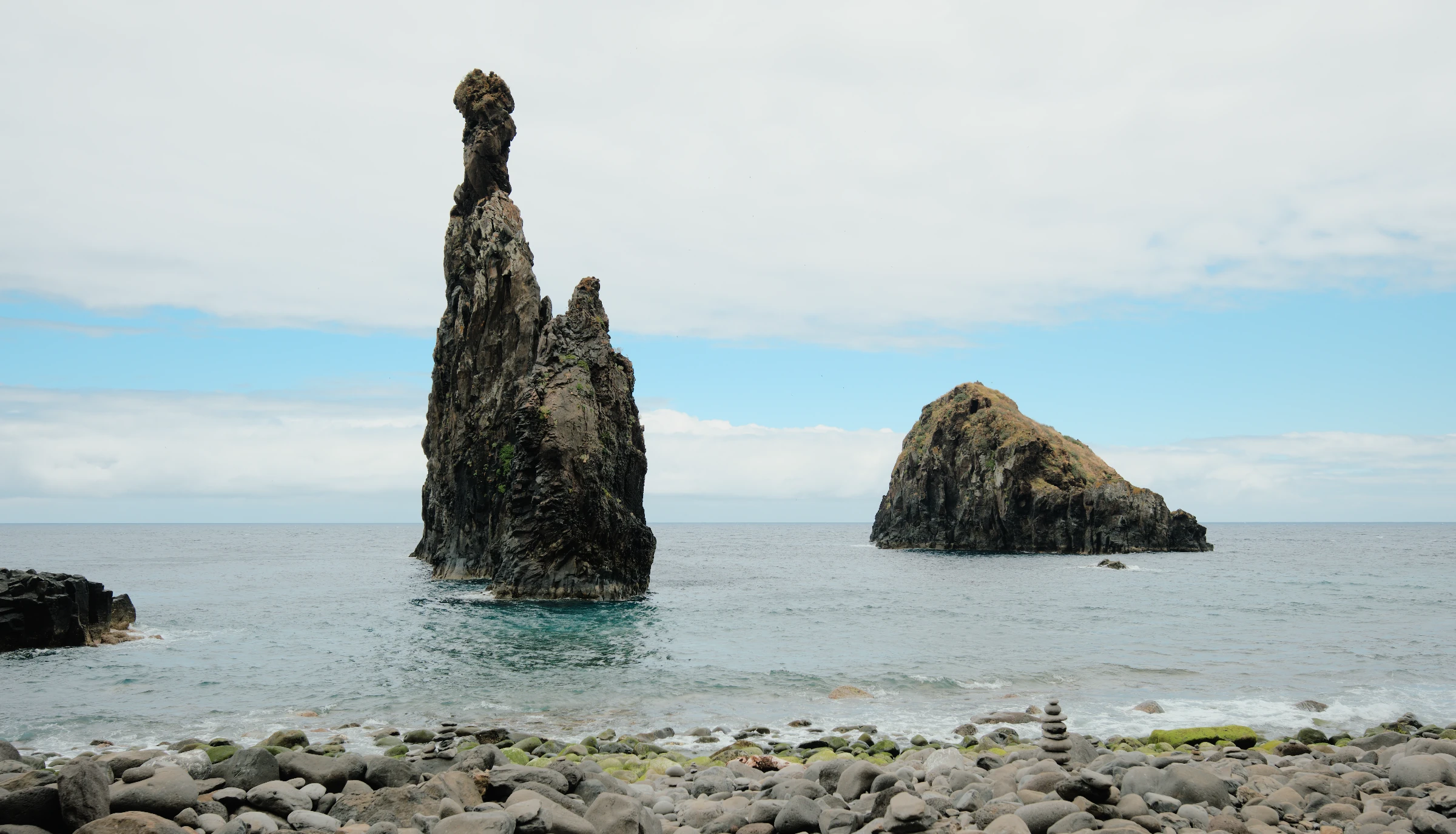 Two sea stacks above blue-green water, developed from a Fujifilm RAW